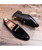 Black buckle decorated leather slip on dress shoe 11