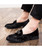 Black leather slip on dress shoes with bow tie design 02