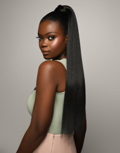 Woman wearing The Feme Collection Slick Ponytail Extension