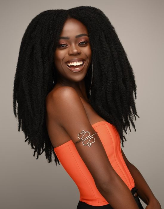 Woman wearing Soft N Silky - Afro Twist Braid