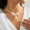 Beaded Bow Necklace: Pearls