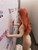 Side view of the 155 cm Sino Doll showing the body profile, blonde wig, arms, and standing feet.
