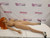 Side lying view of the 158 cm HR Doll Vicky TPE doll showing the full body, legs, and overall condition.