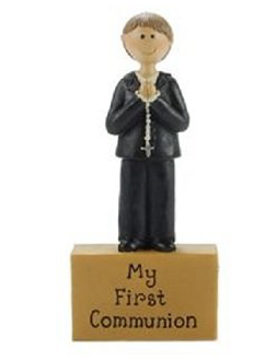 First Communion boy holding a rosary standing atop a block featuring the words "My First Communion". Measures 4.2" x 2". A Blossom Bucket collectible.