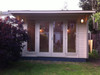 A customer image of the Jubilee Log Cabin painted in specially colour mixed Rystix timber treatment.