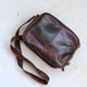 brown oiled leather handbag with  long adjustable shoulder strap