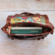 brown oiled leather satchel with floral print lining