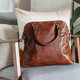 tan leather tote bag with two handles