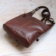 brown leather crossbody bag with zipped back pocket and long strap