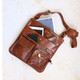 tan leather crossbody bag with front pockets and long adjustable shoulder strap