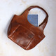 tan leather handbag with front slip pocket