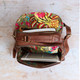 large ladies brown leather backpack with two compartments and fully lined in floral print fabric