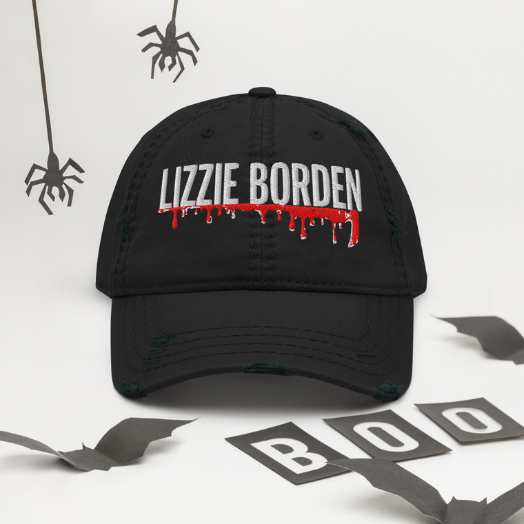 Channel true crime history with the Lizzie Slash Distressed Dad Hat by Westport Harbor — a stylish nod to the infamous Fall River murders of 1892. With its vintage-washed cotton twill, this adjustable cap blends coastal New England edge with eerie historical intrigue.