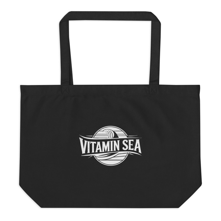 Take your daily dose of coastal calm with the Vitamin Sea Large Organic Dark Tote Bag.