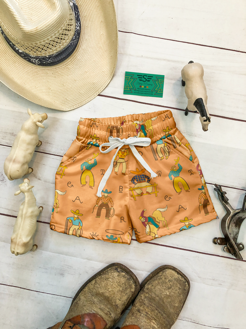 boys cowboy swim trunks, western boys swim shorts, rodeo swim trunks for boys, toddler cowboy swimsuit, western swim trunks, boys orange swim trunks, cowboy print swim shorts, western toddler swimwear, boys western bathing suit, toddler rodeo swim trunks, cowboy themed swim trunks, boys ranch style swim shorts, western summer outfit for boys, boys pool outfit western, cowboy vacation outfit toddler, little cowboy swim trunks, western kids clothing, rodeo kids outfit, country boys swimwear, farm kids summer outfit, cowboy birthday outfit, western boutique kids