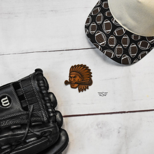 ndian Head Bat Bite leather patch, Indian head leather patch, Braves leather patch, Chiefs leather patch, Warriors leather patch, Tribe leather patch, Native mascot leather patch, school mascot patch, sports mascot leather patch, baseball mascot patch, softball mascot patch, football mascot patch, western leather patch, laser engraved leather patch, genuine leather patch, trucker hat patch, mascot hat patch, custom leather patch, rustic leather patch, team spirit patch