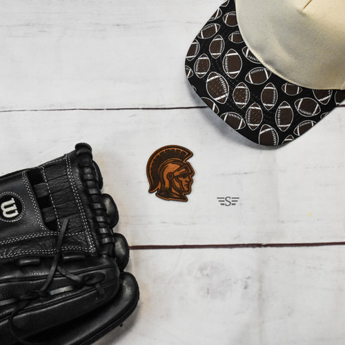 Trojans Leather Patch, Trojan Leather Patch, Spartan Leather Patch, Warriors Leather Patch, Gladiator Leather Patch, Centurion Leather Patch, Greek Warrior Patch, Roman Warrior Patch, School Mascot Patch, Team Spirit Patch, Leather Hat Patch, Laser Engraved Leather Patch, Genuine Leather Patch, Custom Hat Patch, Richardson Hat Patch, Trucker Hat Patch, Football Mascot Patch, Baseball Mascot Patch, Sports Team Patch