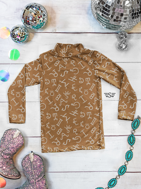 caramel brands, western brands, brand pattern shirt, western undershirt, riding undershirt, horse show shirt, equestrian apparel, performance shirt, cowgirl clothing, ranch wear, rodeo apparel, western performance top, moisture wicking shirt, neutral western apparel, long sleeve riding shirt, base layer, western boutique, horse rider apparel, Flying S Company, western fashion