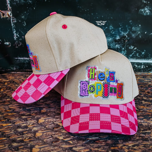 He’s Roping cap, He’s Roping hat, completed canvas cap, western canvas cap, cowgirl canvas hat, western women’s cap, western graphic cap, colorful western hat, rodeo cap, roping hat, cowboy hat for women, cowgirl baseball cap, western baseball hat, patterned bill cap, pink checkered cap, pink western cap, western accessories, cowgirl accessories, trendy western hat, ranch hat, rodeo accessories, Flying S Company cap