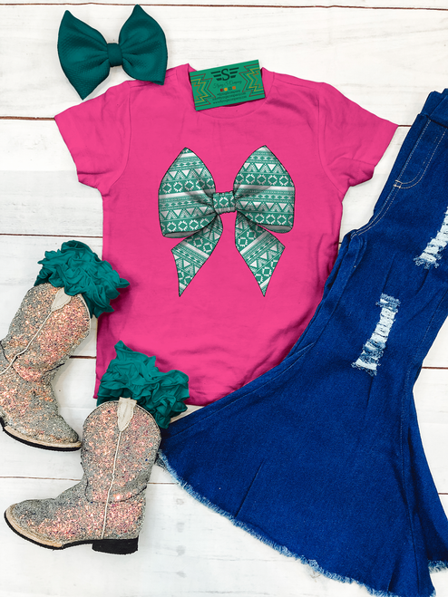 Aztec turquoise bow kids shirt, turquoise bow kids tee, western bow kids shirt, coquette bow kids shirt, Aztec bow shirt, girls western shirt, cowgirl kids shirt, turquoise western tee, western graphic tee for girls, girls cowgirl shirt, western kids clothing, western boutique kids shirt, rodeo kids shirt, stock show kids shirt, trendy girls graphic tee, western coquette shirt, turquoise Aztec shirt, Flying S Company