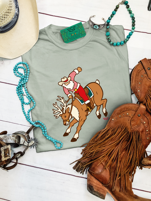 Santa's Half Broke Reindeer shirt, Santa's Half Broke Reindeer crewneck, cowboy Santa Christmas shirt, western Christmas graphic tee, bucking reindeer Christmas shirt, cowboy Christmas sweatshirt, western holiday crewneck, rodeo Santa graphic shirt, Santa riding reindeer shirt, western Christmas sweatshirt, vintage western Christmas tee, funny cowboy Christmas shirt, half broke reindeer graphic tee, western Christmas apparel, cowboy Santa crewneck sweatshirt, ranch life Christmas shirt, Christmas rodeo graphic tee, western boutique Christmas clothing, retro cowboy Christmas shirt, funny western Christmas sweatshirt, cowgirl Christmas graphic tee, western holiday shirt, cowboy Christmas outfit, country Christmas sweatshirt, Christmas gift for cowboys, Flying S Company