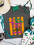 The grass isn't always greener... sometimes there's just a lot more going on over there. Our The Grass Is Only Greener Graphic Tee delivers the perfect mix of sarcastic humor and bold western style. Featuring bright retro-inspired typography over a striped background, this eye-catching graphic is made for anyone who appreciates a little truth with their humor.
Available on Softstyle, Comfort Colors, and a Muscle Tank, this tee is soft, comfortable, and easy to style with your favorite jeans, boots, and turquoise accessories. It's perfect for country concerts, rodeos, girls' trips, or simply making people laugh wherever you go.