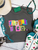 Flying S Magazine Shirt, Magazine Letter Graphic Tee, Colorful Graphic Shirt, Boutique Graphic Tee, Western Boutique Clothing, Retro Graphic Tee, Patchwork Letter Shirt, Statement Graphic Tee, Comfort Colors Shirt, Softstyle Graphic Tee, Western Fashion, Cowgirl Graphic Tee, Boutique Western Shirt, Vintage Style Tee, Country Girl Shirt, Everyday Graphic Tee, Colorful Boutique Top, Women's Graphic Shirt, Trendy Graphic Tee, Western Apparel