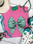 Aztec turquoise coquette bow shirt, turquoise bow shirt, western bow shirt, coquette western shirt, Aztec bow graphic tee, western graphic tee, cowgirl graphic shirt, turquoise western shirt, western coquette tee, southwestern bow shirt, western women’s tee, cowgirl shirt, Aztec print shirt, western boutique shirt, trendy western tee, western bow graphic, turquoise graphic tee, rodeo shirt, stock show shirt, western fashion, western apparel, Flying S Company