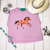 Checkered painted pony graphic shirt, checkered horse graphic tee, western horse shirt for women, pink checkered horse shirt, painted pony graphic tee, western checkered shirt, retro cowgirl graphic tee, colorful horse shirt, checkerboard horse graphic, western boutique shirt, running horse graphic tee, pink western graphic shirt, hand painted horse shirt, western women's clothing, cowgirl fashion shirt, trendy western graphic tee, horse lover shirt, western rodeo shirt, stock show graphic tee, colorful western apparel, orange and pink horse shirt, painted horse graphic shirt, retro western fashion, Flying S Company