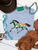 Brushstroke painted pony graphic shirt, brushstroke horse graphic tee, colorful painted pony shirt, western horse graphic shirt, hand painted horse shirt, artistic western graphic tee, turquoise and coral horse shirt, colorful western shirt for women, painted pony western tee, running horse graphic shirt, brushstroke horse design, western boutique clothing, cowgirl graphic tee, abstract painted horse shirt, multicolor horse graphic tee, western women's apparel, horse lover graphic shirt, trendy western fashion, colorful cowgirl shirt, rodeo graphic tee, stock show shirt, modern western graphic shirt, western art inspired tee, boho western shirt, Flying S Company