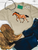 Leopard painted pony graphic shirt, leopard horse graphic tee, western leopard horse shirt, spotted pony graphic tee, leopard print horse shirt, painted pony women's shirt, cowgirl leopard graphic tee, western horse graphic shirt, hand painted horse tee, leopard print western shirt, rustic horse graphic tee, western boutique women's shirt, horse lover graphic tee, animal print horse shirt, western cowgirl clothing, running horse graphic tee, artistic painted horse shirt, orange and brown horse graphic, western rodeo shirt, stock show graphic tee, trendy western women's shirt, boho western horse tee, leopard cowgirl shirt, western equestrian clothing, western boutique graphic tee, Flying S Company