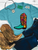 Floral boot graphic shirt, floral cowboy boot shirt, western floral graphic tee, colorful cowboy boot shirt, retro western shirt, vintage floral boot tee, turquoise cowboy boot shirt, western women's graphic tee, cowgirl floral shirt, funky western graphic tee, colorful western shirt, retro cowgirl shirt, western boutique clothing, bright western graphic tee, floral western shirt, boho western shirt, rodeo graphic tee, stock show shirt, country concert outfit, western fashion for women, colorful cowgirl clothing, hand drawn cowboy boot shirt, Flying S Company