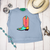 Howdy boot graphic shirt, howdy cowboy boot shirt, western boot graphic tee, colorful cowboy boot shirt, howdy western shirt, retro cowboy boot tee, turquoise cowboy boot shirt, pink howdy shirt, western graphic shirt, cowgirl graphic tee, western boutique women's shirt, colorful western shirt, howdy graphic tee, retro western graphic shirt, bold western shirt, rodeo graphic tee, stock show shirt, country concert shirt, funky western tee, western fashion shirt, cowboy boot graphic tee, western women's clothing, vintage inspired western shirt, Flying S Company
