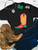 Vibrant sun boot graphic shirt, sun cowboy boot shirt, western graphic tee for women, colorful cowboy boot shirt, sunshine western graphic tee, sunburst cowboy boot shirt, retro western women's shirt, peach cowboy boot graphic tee, coral western graphic shirt, turquoise cowboy boot shirt, sunset western graphic tee, funky western women's shirt, vibrant cowgirl shirt, colorful western boutique tee, retro cowgirl fashion, sunshine cowgirl graphic tee, trendy western apparel, women's cowboy boot shirt, rodeo graphic tee, stock show shirt, country concert outfit, bright western graphic shirt, summer western tee, western boutique clothing, Flying S Company