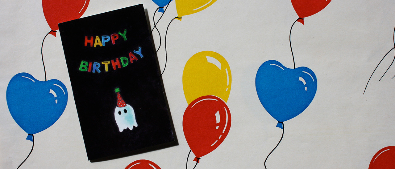 "Happy Birthday" Ghost Card on Wrapping Papewr 