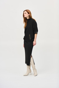 This Joseph Ribkoff sweater knit mid-calf length skirt has a covered elastic waistband, and side slit.