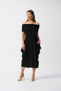 This silky knit dress has a stunning cocoon silhouette and features a cowl neck and short sleeves with slit detail at the back of the hemline