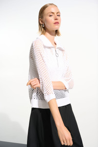 Leisurewear gets a modern lift in this open stitch sweater.