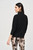 Joseph Ribkoff chic silky knit top featuring a turtleneck, boxy silhouette, beautiful eyelets and three quarter dolman sleeves.