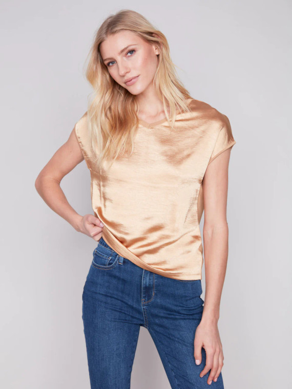 Charlie B flattering satin knit top with a V neckline, short dolman sleeves and relaxed fit.