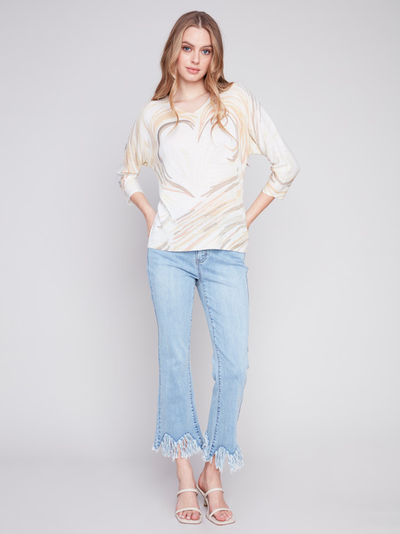 Charlie B light and breathable three-quarter sleeve sweater comes in two charming prints.