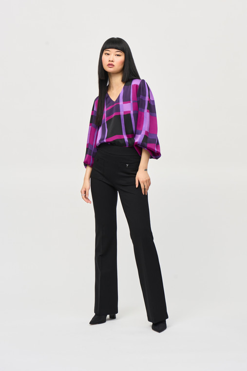 This Joseph Ribkoff satin top features an alluring abstract plaid print, long puffed sleeves with elastic cuffs, boxy silhouette and a V-shaped neckline.
