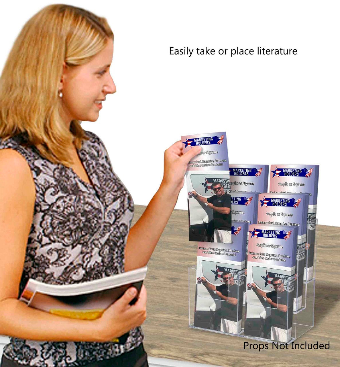 Six pocket tiered countertop and wall brochure holder on desk with tri folds