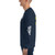 Side view of a male model wearing a navy blue long-sleeved shirt with the Aloha Laundry Life logo on the sleeve in white. The design at the center is partially visible.