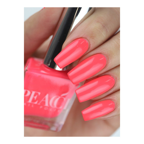 Hand holding bottle of Peacci Madonna nail polish from The GelBottle Inc showing off it's bright pink colors on square nails