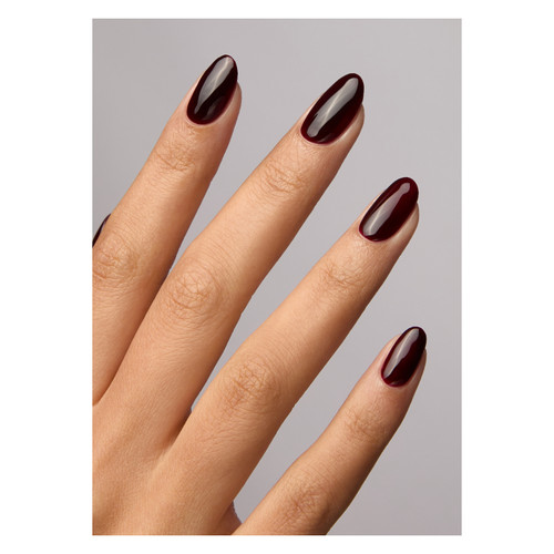 Hand model wearing Manor Mini by The GelBottle Inc., highlighting a bold rouge noir manicure with dramatic depth and a glassy finish.