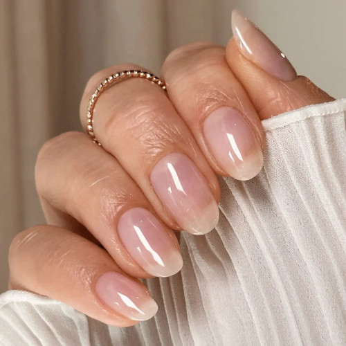 Rosy sheer gel polish “Haze” by TGB on natural nails, soft neutral manicure with glossy finish, perfect for subtle ombré and modern French nail looks