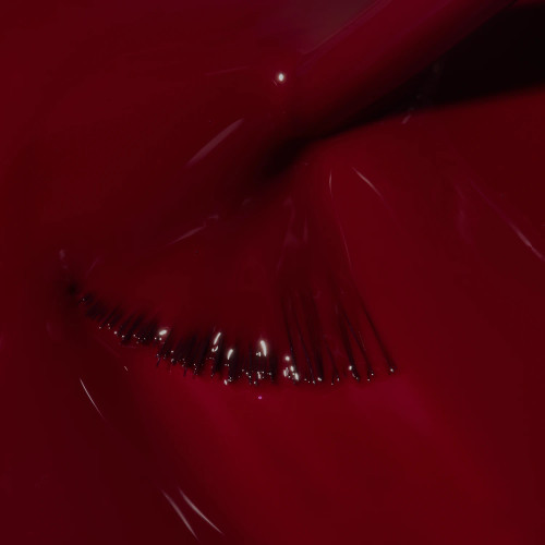 Nail brush swirling through Rogue Mini classic rich red gel polish from The GelBottle Inc's Heist Collection