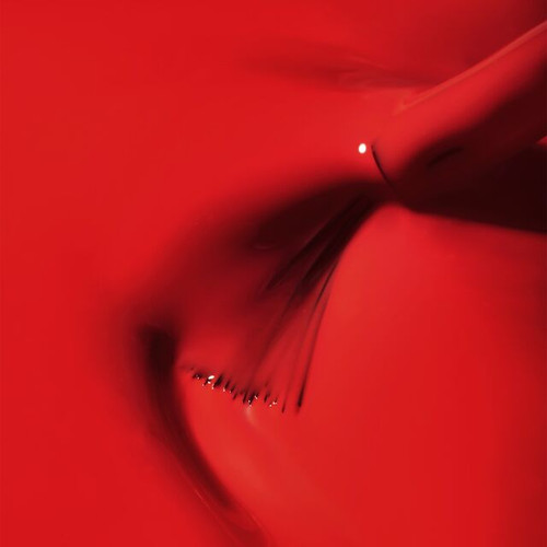 Vivid red gel nail polish close-up with a glossy, high-shine swirl from The GelBottle Inc's Route 66 Shade