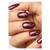 Rendezvous by TGB painted on almond shaped nails showcasing the red and gold glitter on the burgundy color polish.